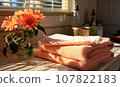 Towels on the table against the background of the window. 107822183