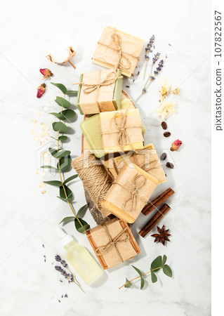 Bars of natural handmade soap and ingredients on marble background, top view Bars of natural handmade soap and ingredients on marble background, top view 107822567