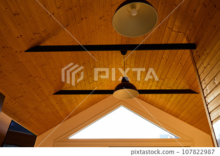 Ceiling in wooden house with lamps. Part of stylish interior Ceiling in wooden house with lamps. Part of stylish interior 107822987