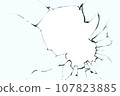 Broken glass with cracks and a big hole. Black cracks on blue glass with a white background. 107823885