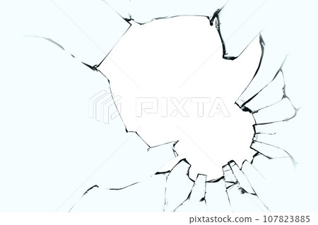Broken glass with cracks and a big hole. Black cracks on blue glass with a white background. 107823885