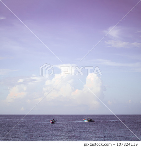 Sea sky cumulus cloud landscape view background. Calm water alone fishing boat. Destination aim progress concept Sea sky cumulus cloud landscape view background. Calm water alone fishing boat. Destination aim progress concept 107824119