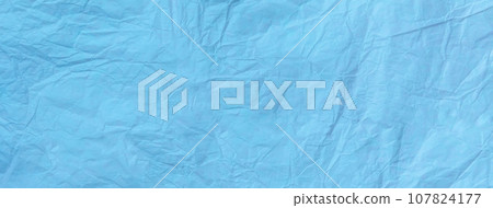 Texture of vintage crumpled light blue wrapping paper, closeup. Sky old background, macro. Texture of vintage crumpled light blue wrapping paper, closeup. Sky old background, macro. 107824177