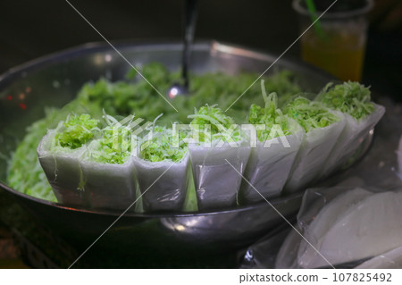 Closeup of pandan sticky rice with coconut milk on the street food in Ho Chi Minh City 107825492