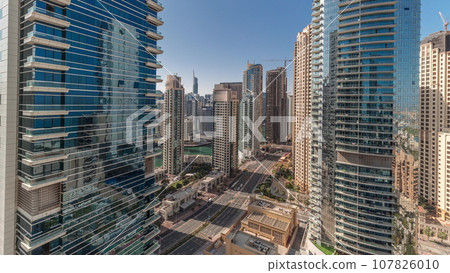 Panoramic view of the Dubai Marina and JBR area and the famous Ferris Wheel aerial timelapse Panoramic view of the Dubai Marina and JBR area and the famous Ferris Wheel aerial timelapse 107826010