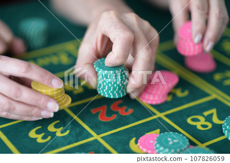 hand of the player making the bet in a casino hand of the player making the bet in a casino 107826059