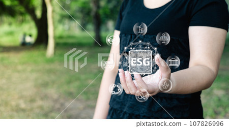 woman are raising the global to save energy, and reduce world warming, and climate change, ecology friendly investment, ESG for Environment Social and Governance. Sustainable business concept. woman are raising the global to save energy, and reduce world warming, and climate change, ecology friendly investment, ESG for Environment Social and Governance. Sustainable business concept. 107826996