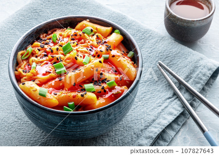 Rabokki, tteokbokki or topokki with ramen, Korean street food, spicy rice cakes Rabokki, tteokbokki or topokki with ramen, Korean street food, spicy rice cakes 107827643