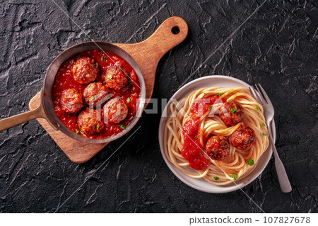 Meatballs. Beef meat balls, overhead flat lay shot in a pan and with spaghetti 107827678