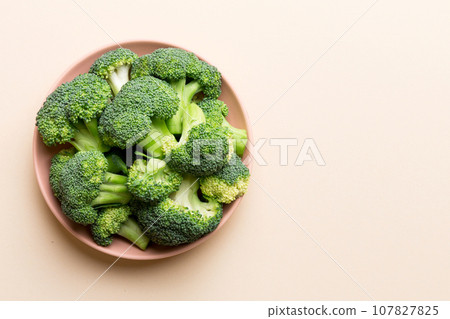 broccoli of fresh green broccoli in bowl over coloredbackground. , close up. Fresh vegetable 107827825