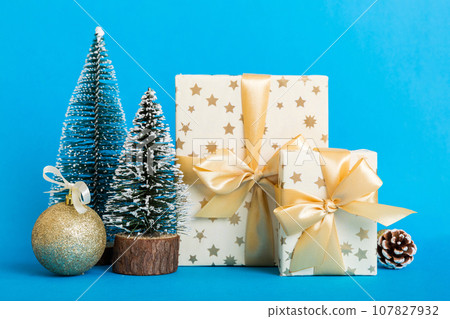 Christmas composition. craft Gift box, small tree, branches and craft DIY decorations on white background. New year concept. Christmas home decoration Flat lay, top view, copy space Christmas composition. craft Gift box, small tree, branches and craft DIY decorations on white background. New year concept. Christmas home decoration Flat lay, top view, copy space 107827932