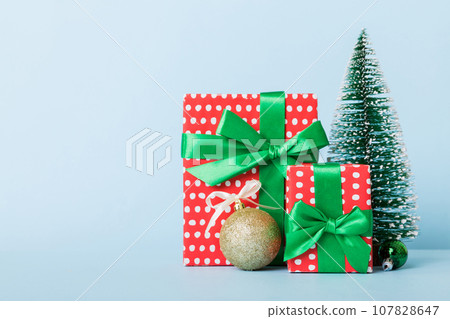 Christmas composition. craft Gift box, small tree, branches and craft DIY decorations on white background. New year concept. Christmas home decoration Flat lay, top view, copy space Christmas composition. craft Gift box, small tree, branches and craft DIY decorations on white background. New year concept. Christmas home decoration Flat lay, top view, copy space 107828647