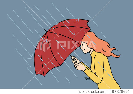 Woman with umbrella rushes home during rain and storm caused by sudden cold snap in autumn Woman with umbrella rushes home during rain and storm caused by sudden cold snap in autumn 107828695