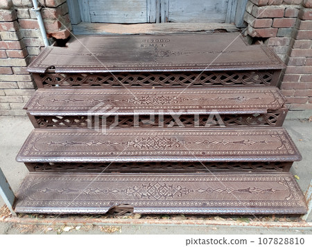 An old pre revolutionary porch made of steel. Iron porch steps. An old pre revolutionary porch made of steel. Iron porch steps. 107828810