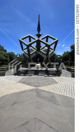 Taiwan 228 Memorial Park monument in sunlight, reflected on the ground. 107829095