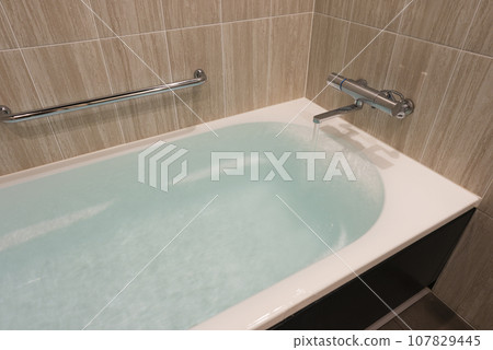 bathtub overflowing with hot water bathtub overflowing with hot water 107829445
