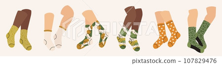 Legs in socks. Cartoon feet wearing cotton wool stockings, man and woman feet in hosiery, fashion concept. Vector set Legs in socks. Cartoon feet wearing cotton wool stockings, man and woman feet in hosiery, fashion concept. Vector set 107829476
