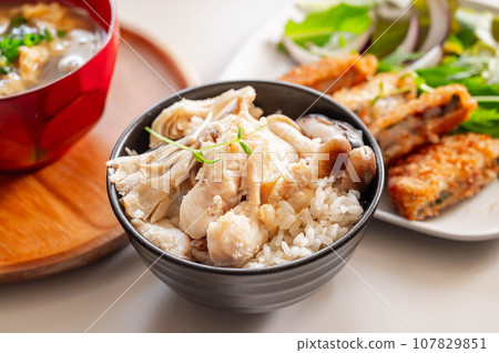 Rice cooked with chicken and mushrooms 107829851