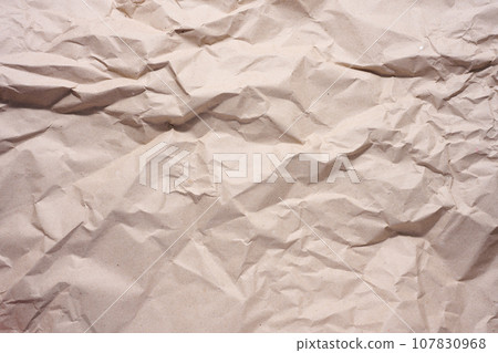 Texture of brown crumpled craft paper, full frame Texture of brown crumpled craft paper, full frame 107830968