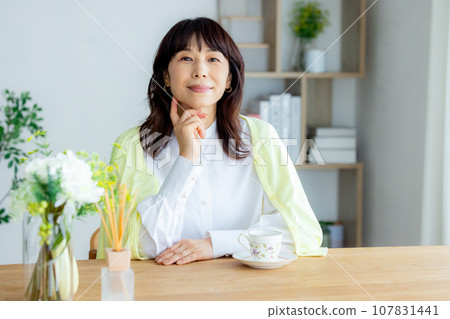 A woman with a coffee cup A woman with a coffee cup 107831441