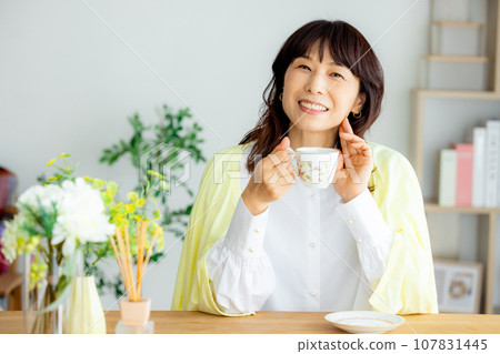 A woman with a coffee cup A woman with a coffee cup 107831445