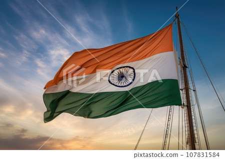 Indian flag waving on blue sky background 107831584