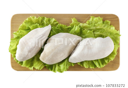 boiled chicken fillet on a cutting board isolated on white background top view. 107833272