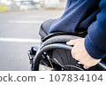 man rowing a wheelchair 107834104