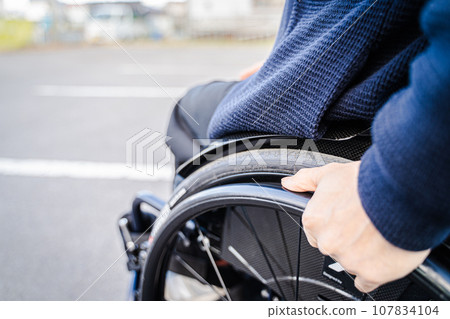 man rowing a wheelchair 107834104