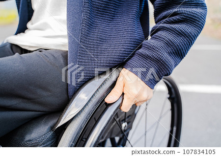 man rowing a wheelchair 107834105