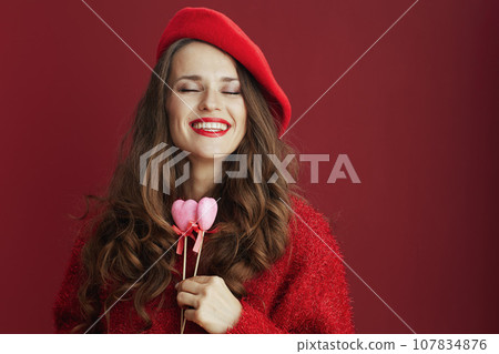 smiling modern woman with long wavy hair 107834876