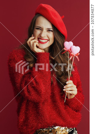 happy trendy woman in red sweater and beret happy trendy woman in red sweater and beret 107834877