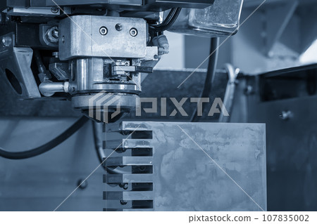 Closeup scene the wire EDM machine cutting the mold insert parts. 107835002