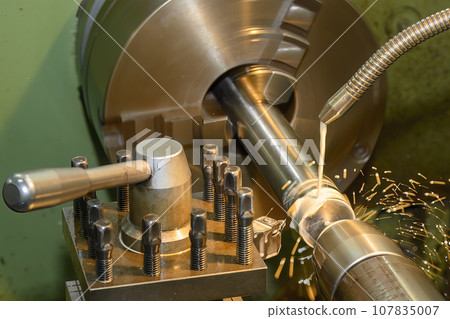 The lathe machine finish cut metal shaft parts with liquid coolant method. The lathe machine finish cut metal shaft parts with liquid coolant method. 107835007