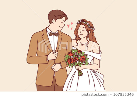 Wedding ceremony at bride and groom in beautiful outfits holding hands during engagement in church Wedding ceremony at bride and groom in beautiful outfits holding hands during engagement in church 107835346