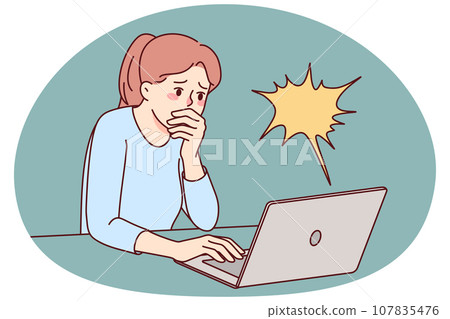 Stunned woman shocked by news on laptop 107835476