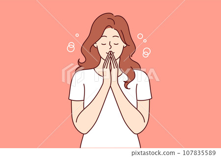 Praying woman performs meditation or religious ritual to purify thoughts and get rid of bad emotions Praying woman performs meditation or religious ritual to purify thoughts and get rid of bad emotions 107835589