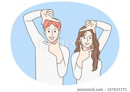 Smiling couple make frame gesture with hands Smiling couple make frame gesture with hands 107835771