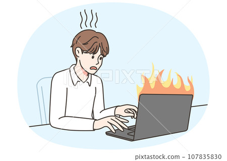 Man work on burning computer Man work on burning computer 107835830