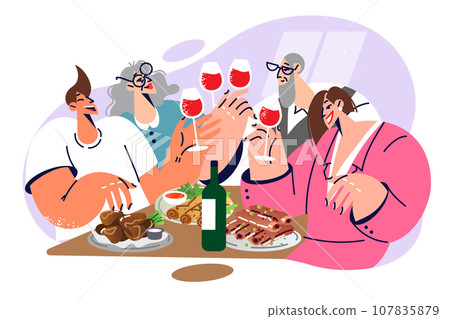 Festive feast of large family with wine and delicious dinner celebrating weekend Festive feast of large family with wine and delicious dinner celebrating weekend 107835879