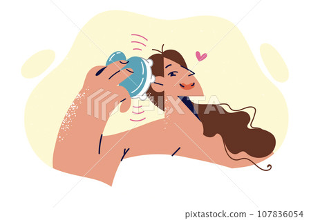 Woman uses head massager after getting out of shower to relieve cranial pressure and stress Woman uses head massager after getting out of shower to relieve cranial pressure and stress 107836054