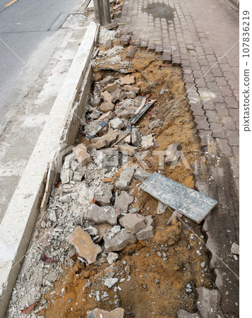 The footpath way is broken from the erosion of the rain. The footpath way is broken from the erosion of the rain. 107836219