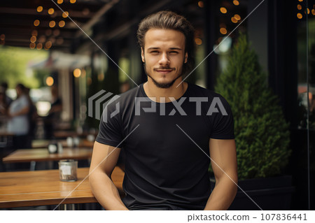 A Young Man Flaunts Bella Canvas Black T-Shirt and Jeans, Relishing Sunshine at a Cozy Restaurant, Showcasing T-Shirt Design Template and Print Presentation Mockup. created with Generative AI 107836441