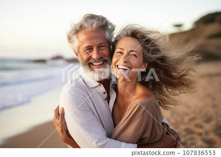 A Joyful Middle-Aged Couple, a Man and Woman, Sharing a Heartfelt Hug on a Sun-Kissed Beach. created with Generative AI 107836553