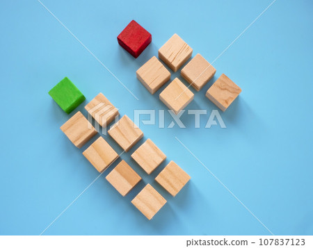 Two columns with red and green cube. Market segmentation and Target audience. Two columns with red and green cube. Market segmentation and Target audience. 107837123