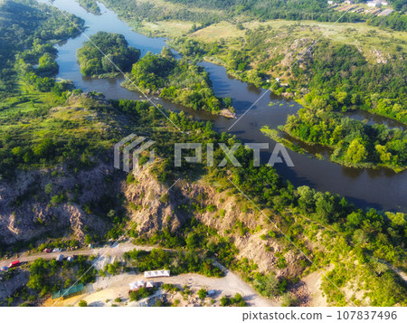 Winding bed of the Southern Bug river. River, landscape from a bird's eye view. Rough, rocky terrain. 107837496