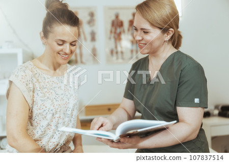 happy female massage therapist conduct educational training happy female massage therapist conduct educational training 107837514