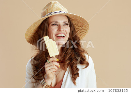 happy trendy housewife in blouse and shorts isolated on beige happy trendy housewife in blouse and shorts isolated on beige 107838135