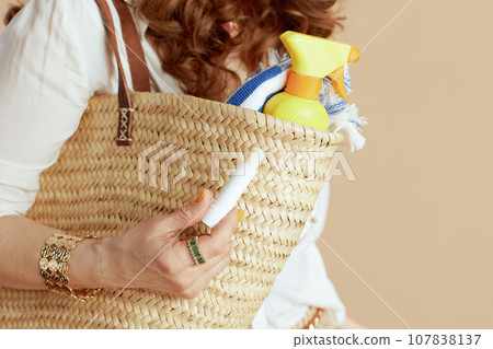 Modern woman in blouse and shorts on beige 107838137