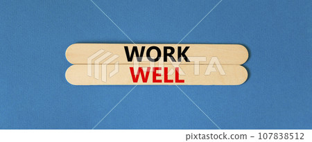 Work well symbol. Concept words Work well on wooden stick. Beautiful blue table blue background. Business marketing, motivational work well concept. Copy space. 107838512